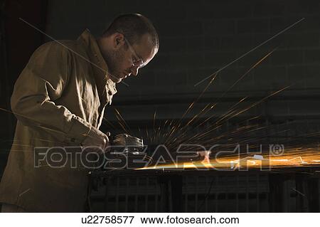 Steel grinder working in metal shop View Large Photo Image Stock Photo - Steel grinder working in metal shop. Fotosearch