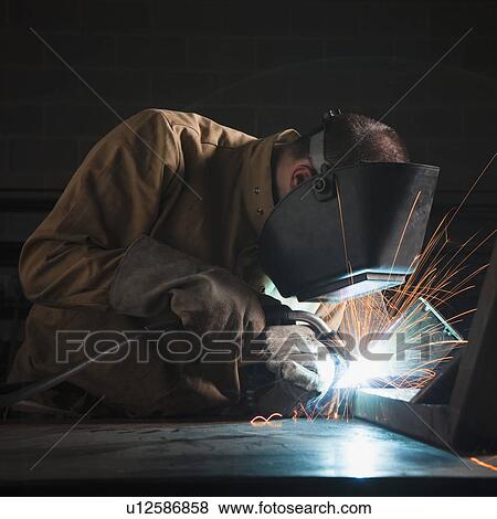 Steel worker in metal shop View Large Photo Image Stock Photo - Steel worker in metal shop. Fotosearch