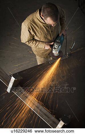 Stock Photograph - Steel worker in metal shop. Fotosearch