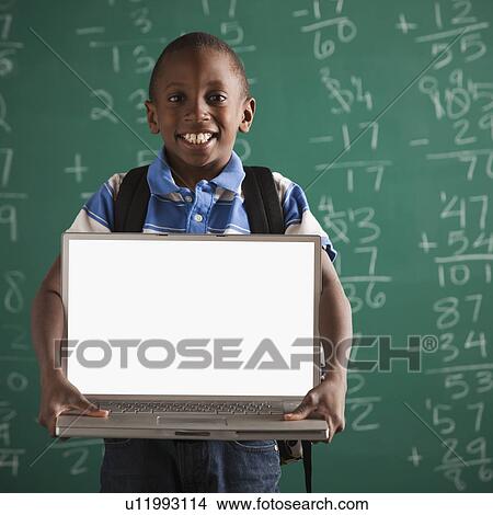 Student holding laptop View Large Photo Image Picture - Student holding laptop. Fotosearch