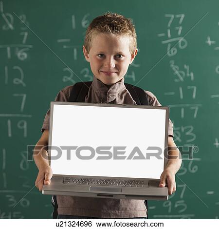 Stock Photograph - Student holding laptop. Fotosearch