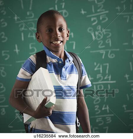 Picture - Student in classroom. Fotosearch