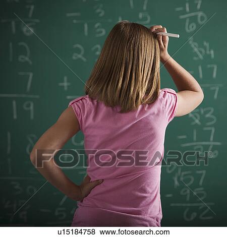 Stock Photo - Student in front of chalkboard. Fotosearch