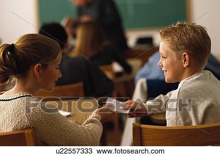 Students passing note in classroom View Large Photo Image Stock Image - Students passing note in classroom. Fotosearch