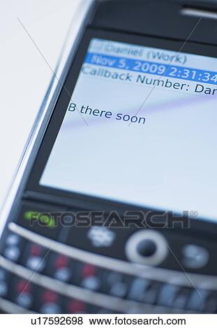 Stock Photo - Text on cell phone. Fotosearch