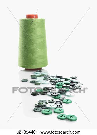 Stock Image - Thread and buttons. Fotosearch