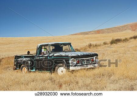 Stock Image - Truck in field. Fotosearch