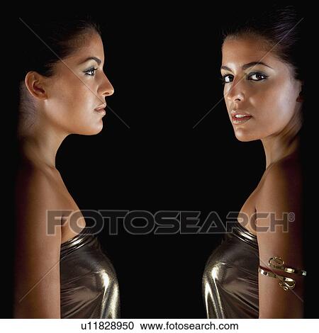 Two woman dressed in gold View Large Photo Image Stock Image - Two woman dressed in gold. Fotosearch