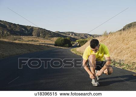 Stock Photography - Tying shoelaces. Fotosearch