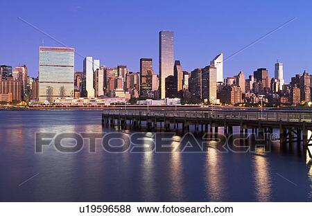 Stock Photo - Waterfront cityscape at night. Fotosearch