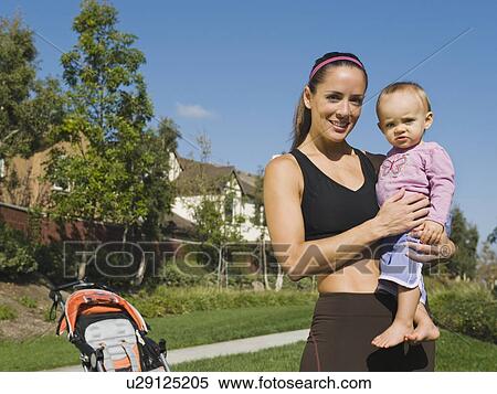 Stock Photography - Woman and baby. Fotosearch