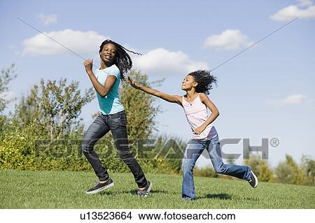Picture - Woman and girl running. Fotosearch