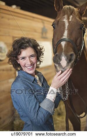 Stock Image - Woman and horse. Fotosearch
