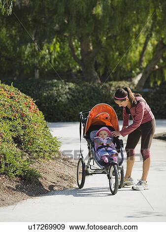 Woman and stroller View Large Photo Image Stock Photo - Woman and stroller. Fotosearch