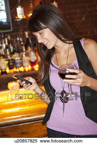 Woman at bar View Large Photo Image Stock Photography - Woman at bar. Fotosearch