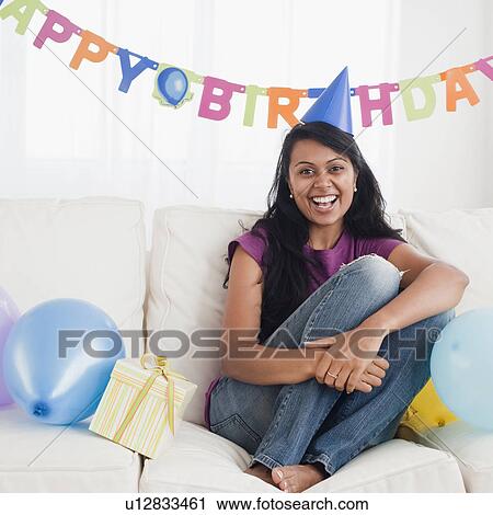 Woman at birthday party View Large Photo Image Stock Image - Woman at birthday party. Fotosearch