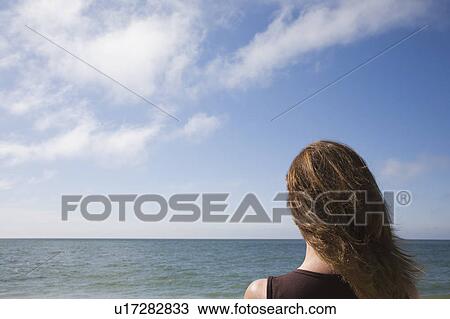 Woman at the beach View Large Photo Image Stock Image - Woman at the beach. Fotosearch