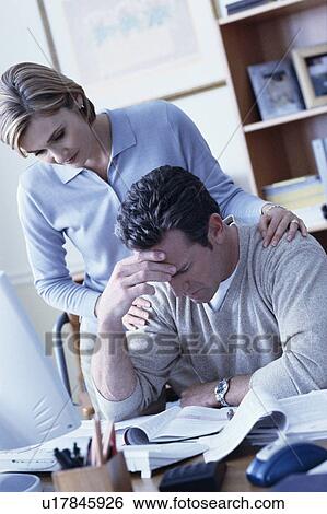 Woman consoling man View Large Photo Image Stock Photograph - Woman consoling man. Fotosearch