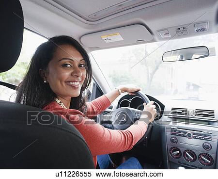Woman driving car View Large Photo Image Stock Photography - Woman driving car. Fotosearch