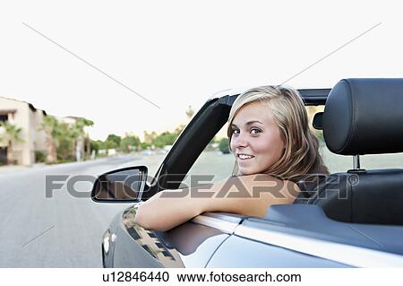 Woman driving convertible View Large Photo Image Stock Image - Woman driving convertible. Fotosearch