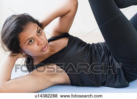 Stock Photo - Woman exercising. Fotosearch