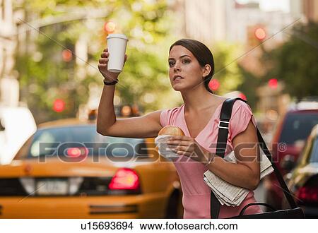 Woman hailing cab View Large Photo Image Picture - Woman hailing cab. Fotosearch
