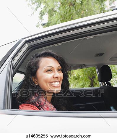 Woman in car View Large Photo Image Stock Photography - Woman in car. Fotosearch