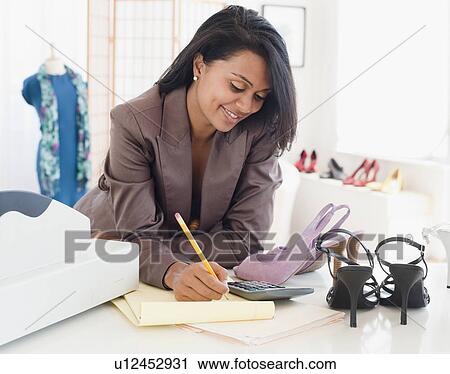 Woman in shoe store View Large Photo Image Stock Image - Woman in shoe store. Fotosearch