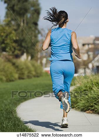 Stock Image - Woman jogging. Fotosearch