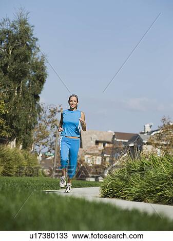 Woman jogging View Large Photo Image Stock Image - Woman jogging. Fotosearch