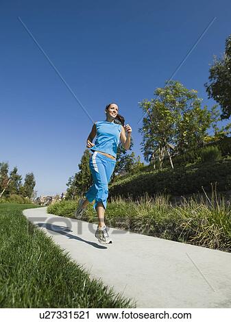 Stock Image - Woman jogging. Fotosearch