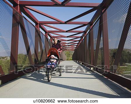 Woman jogging with stroller View Large Photo Image Stock Image - Woman jogging with stroller. Fotosearch