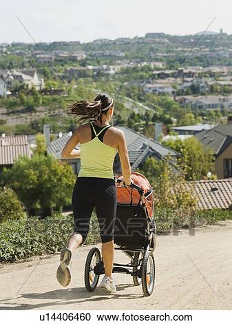 Woman jogging with stroller View Large Photo Image Stock Image - Woman jogging with stroller. Fotosearch