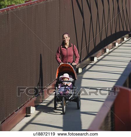 Stock Photo - Woman jogging with stroller. Fotosearch