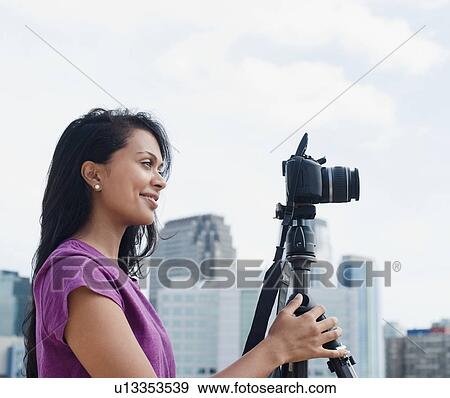 Stock Photo - Woman looking at camera. Fotosearch
