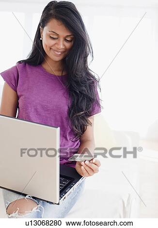 Woman shopping online View Large Photo Image Stock Image - Woman shopping online. Fotosearch