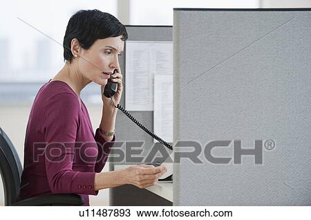 Stock Image - Woman talking on phone. Fotosearch