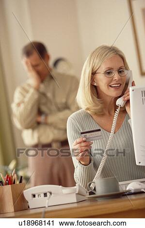 Stock Image - Woman talking on telephone. Fotosearch