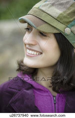 Stock Image - Woman wearing hat. Fotosearch