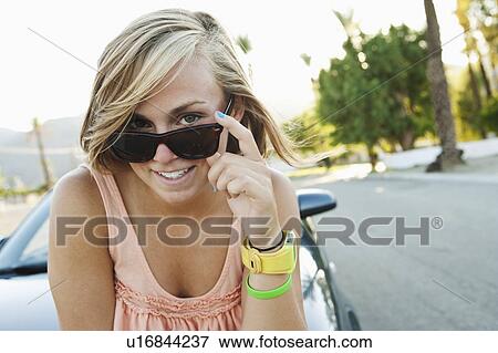 Woman wearing sunglasses View Large Photo Image Stock Photo - Woman wearing sunglasses. Fotosearch