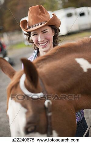 Stock Photography - Woman with horse. Fotosearch