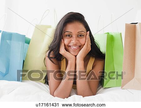 Stock Image - Woman with shopping bags. Fotosearch