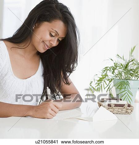 Stock Image - Woman writing. Fotosearch