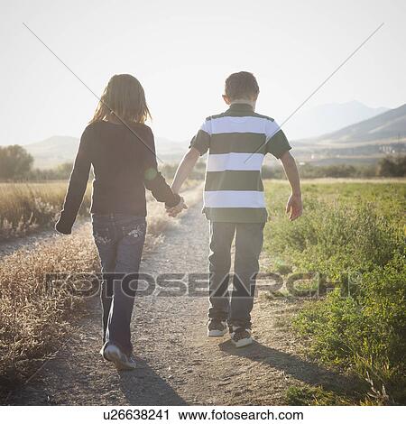 Stock Image - Young children walking on path. Fotosearch