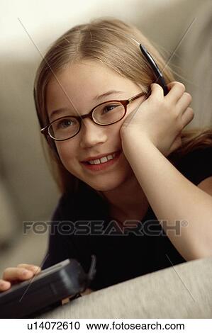 Stock Image - Young girl playing game. Fotosearch