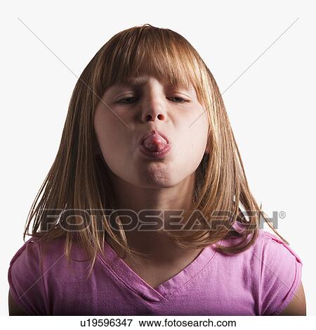 Stock Photo - Young girl sticking tongue out. Fotosearch