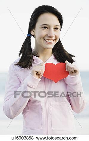 Stock Photo - Young girl with pony tails. Fotosearch