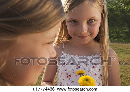 Stock Photograph - Young girls smiling. Fotosearch