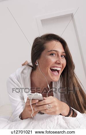 Stock Image - Young woman laughing. Fotosearch