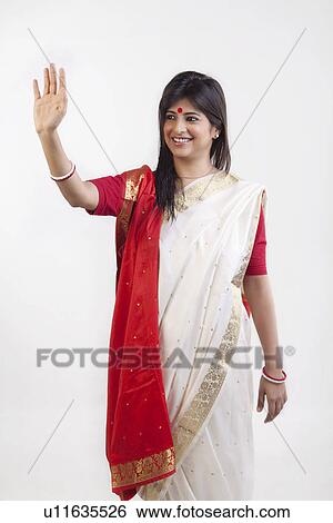 A Bengali woman waving View Large Photo Image Stock Photograph - A Bengali woman waving. Fotosearch